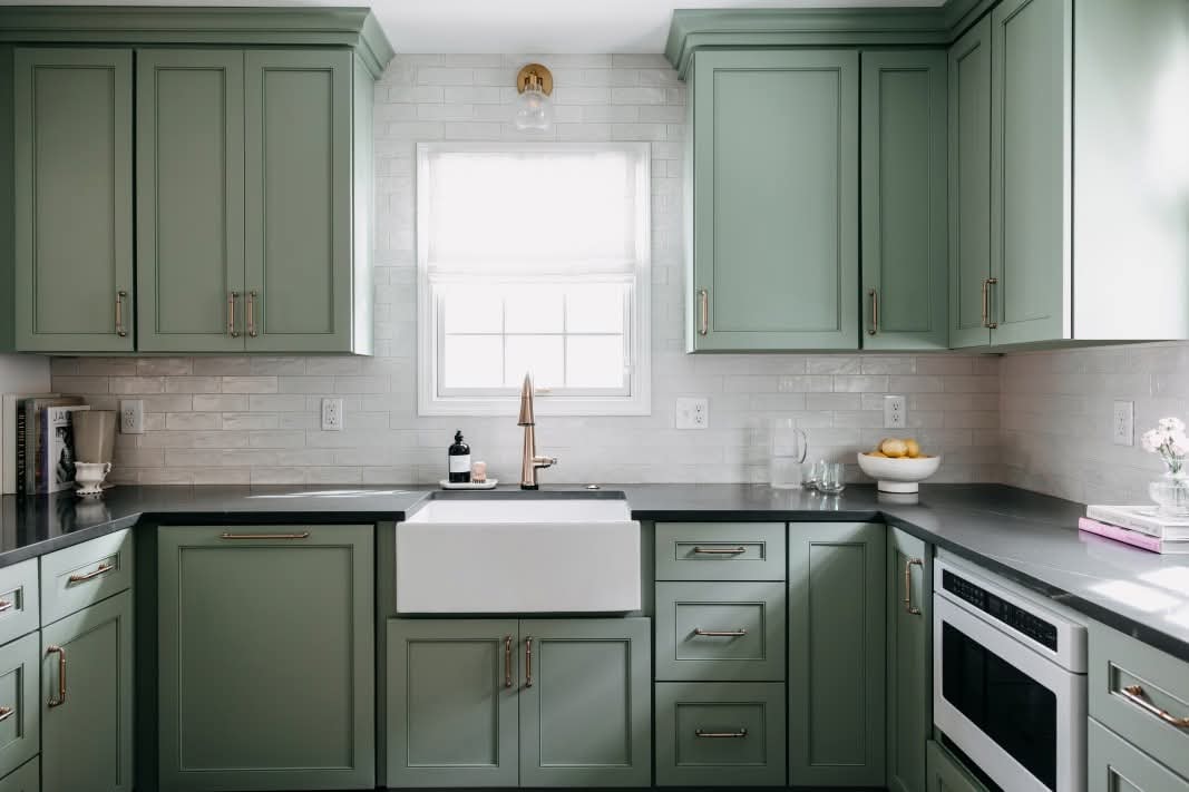 Cherry Creek kitchen — sage green cabinetry with white subway tile backsplash