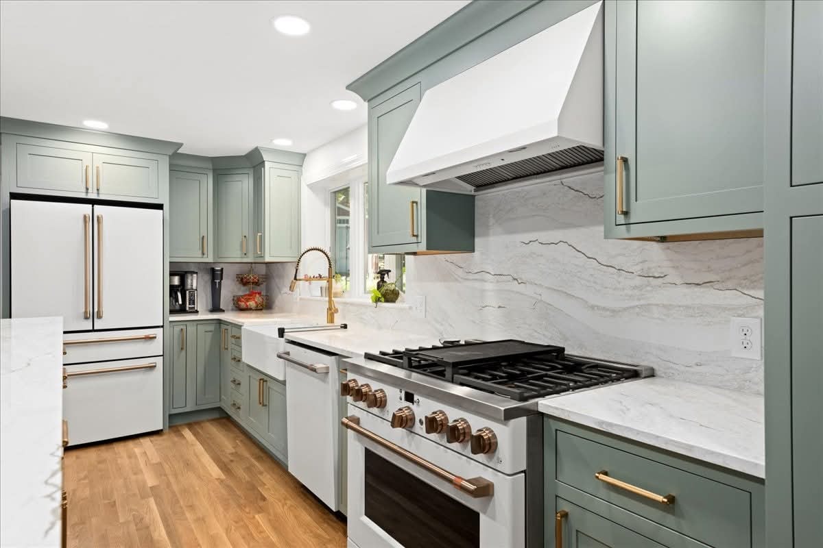Cherry Creek kitchen — sage green shaker cabinetry with marble countertops and farmhouse sink